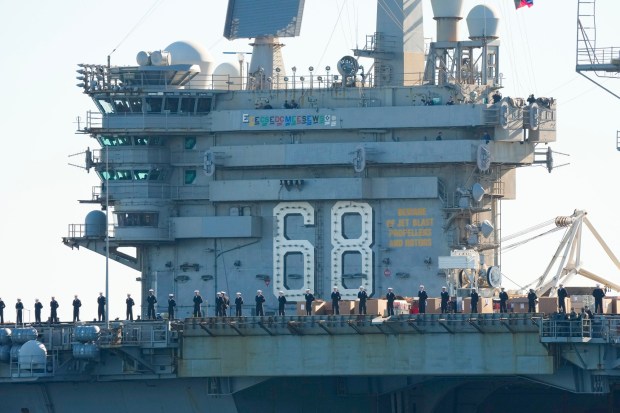 The USS Nimitz (CVN-68) makes her way into San Diego Bay mid-morning on Sunday, Dec. 7, 2025, in San Diego, CA. The Nimitz, which was ported in San Diego for 11 years, is finishing a 50-year service life and will be decommissioned next year. (Nelvin C. Cepeda / The San Diego Union-Tribune)
