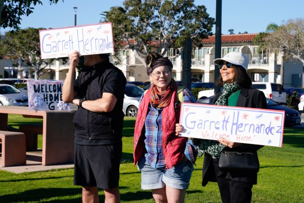 The USS Nimitz makes her way into San Diego Bay mid-morning on Sunday, Dec. 7, 2025, in San Diego, CA. The Nimitz, which was ported in San Diego for 11 years, is finishing a 50-year service life and will be decommissioned next year. Family members of sailor Garrett Hernandez watched from Shelter Island as the Nimitz made her way towards North Island NAS. (Nelvin C. Cepeda / The San Diego Union-Tribune)