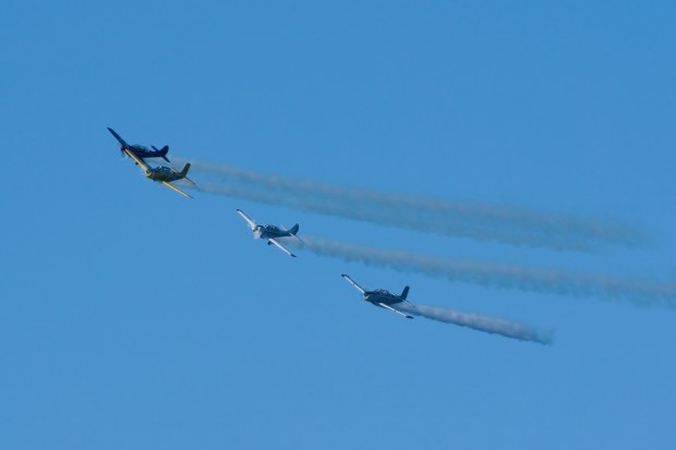 During the 84th Annual Pearl Harbor Remembrance Day Ceremony, vintage military aircraft maneuvered into the missing man formation over the USS Midway Museum on Saturday. (Nelvin C. Cepeda / The San Diego Union-Tribune)