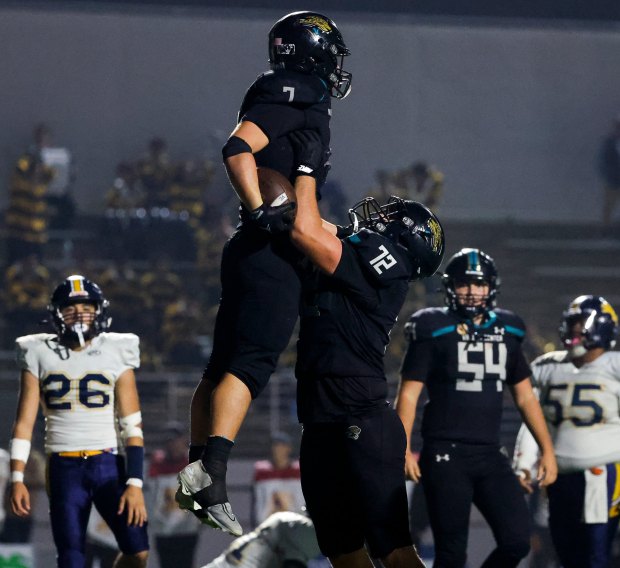 Valley Center's Joeisha Ryan Tirado #7 and Peyton Stroh #72 celebrate after a touchdown against San Jose Lincoln during the Division 6-AA State Championship at Fullerton College on Friday, Dec. 12, 2025 in Fullerton, California. (Meg McLaughlin / The San Diego Union-Tribune)