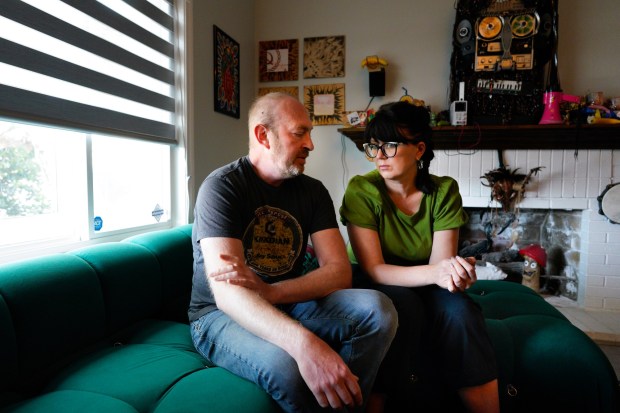 At their home in the north county, Viktoriia Bulavina, sitting next to her husband, Victor Korol, thinks back to the time when ICE agents arrested her while she was being interviewed about her visa extension. (Nelvin C. Cepeda / The San Diego Union-Tribune)