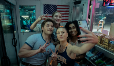 a woman smiles while wearing a suit