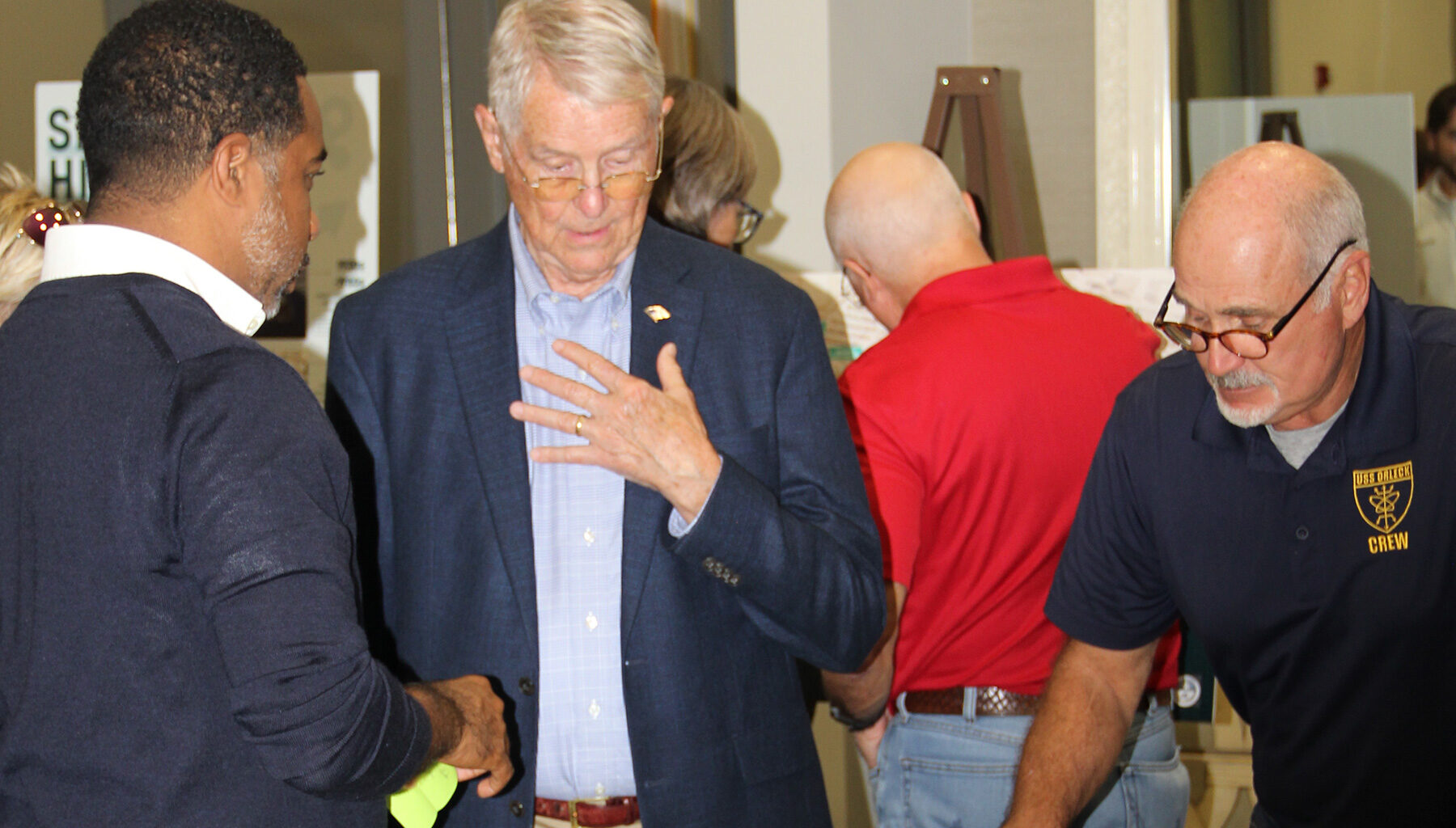 USS Orleck Naval Museum Ship Manager Jim Fossa, pictured right, and William Harrell discuss the latest design of the Shipyards West Park with Daryl Joseph, City of Jacksonville Parks, Recreation and Community Services director.