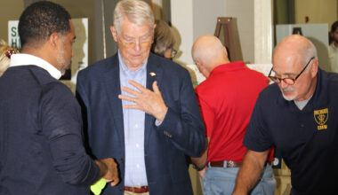 USS Orleck Naval Museum Ship Manager Jim Fossa, pictured right, and William Harrell discuss the latest design of the Shipyards West Park with Daryl Joseph, City of Jacksonville Parks, Recreation and Community Services director.