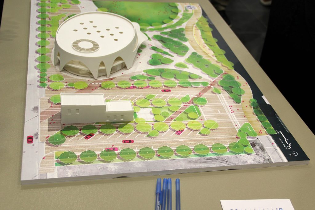 In this model, the small, white rectangleat the edge of the boardwalkis the only recognition of the USS Orleck Naval Museumand the infrastructure in place to allow access to the ship.