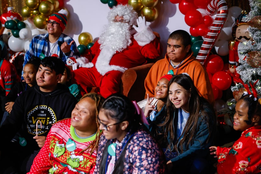 Students take a photo with Santa during Operation Officer Claus at Seagoville High School on...