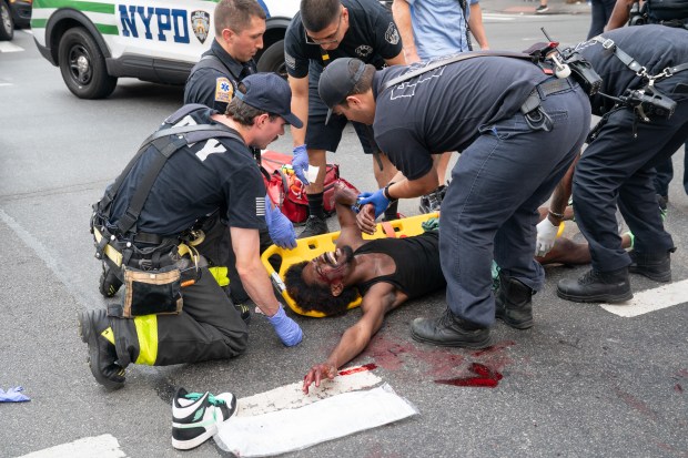 An alleged assault perp is pictured after running into traffic and being hit by a vehicle while fleeing police Monday, July 21, 2025 in Manhattan, New York. (Barry Williams/ New York Daily News)