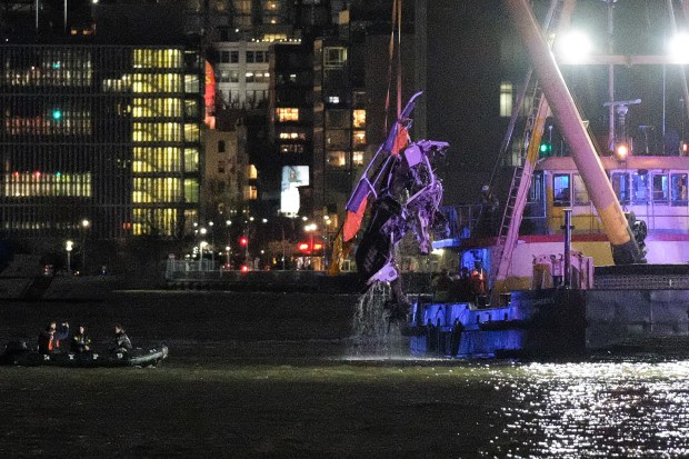 The mangled wreckage of a helicopter is lifted from the Hudson River in Jersey City, New Jersey after it crashed on Thursday, April 10, 2025. (Gardiner Anderson / New York Daily News)