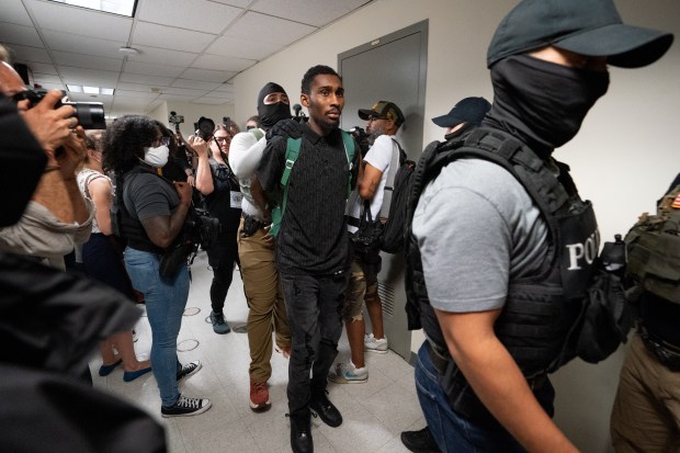 Federal law enforcement officers take immigrants into custody in Jacob K. Javits Building on Thursday, Jul. 3, 2025 in Manhattan. (Barry Williams/ New York Daily News)
