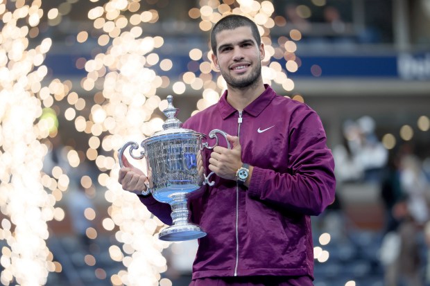 Carlos Alcaraz holds the U.S. Open men's singles tennis championship trophy at the USTA Billie Jean King National Tennis Center in Flushing New York on Sept. 7, 2025. (Andrew Schwartz)