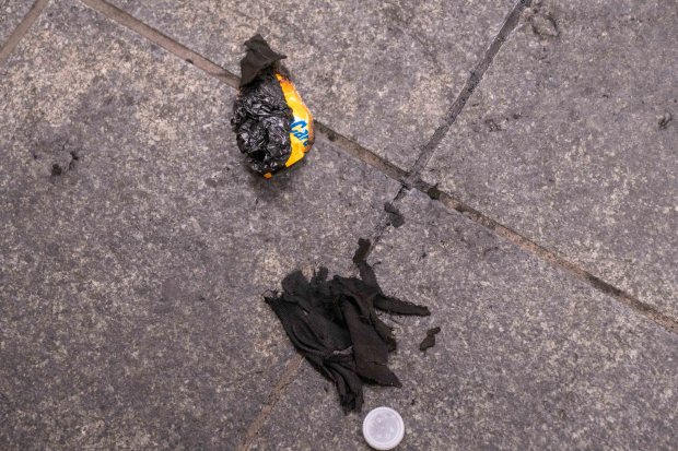 Remnants of a MetroCard and burnt cloth are pictured after a homeless man was set on fire while sleeping on an uptown No. 3 subway train approaching the Times Square stop in Manhattan early Monday, Dec. 1, 2025. (Theodore Parisienne / New York Daily News)