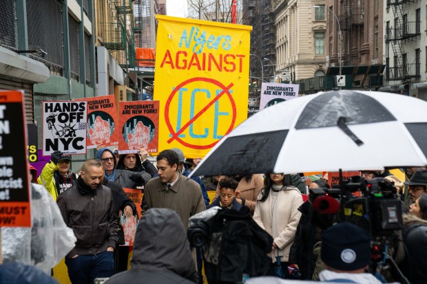 Local politicians and immigration advocates hold a rally Sunday outside a lower Manhattan parking garage where protesters were arrested for blocking a planned ICE operation. 