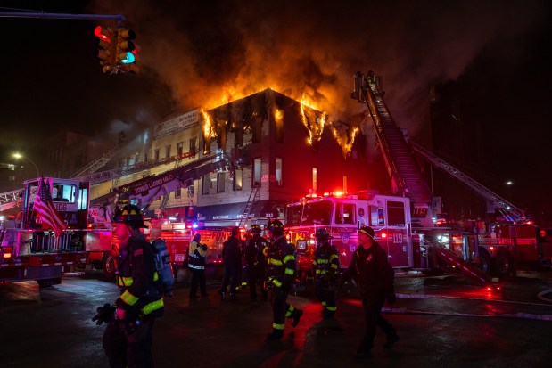 Four alarm fire on the top floor of a three story residential building at the corner of Metropolitan Ave and Graham Ave in Brooklyn, Saturday, Jan. 25, 2025. (Shawn Inglima/New York Daily News)