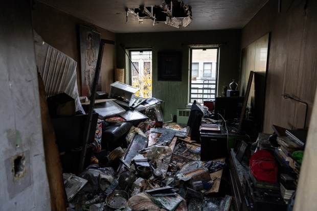 FDNY Fire Investigators inspecting a fatal fire that occurred on the top floor of a five story residential building at 409 East 81st St. in Manhattan, Wednesday, Nov. 12, 2025. (Shawn Inglima/ New York Daily News)