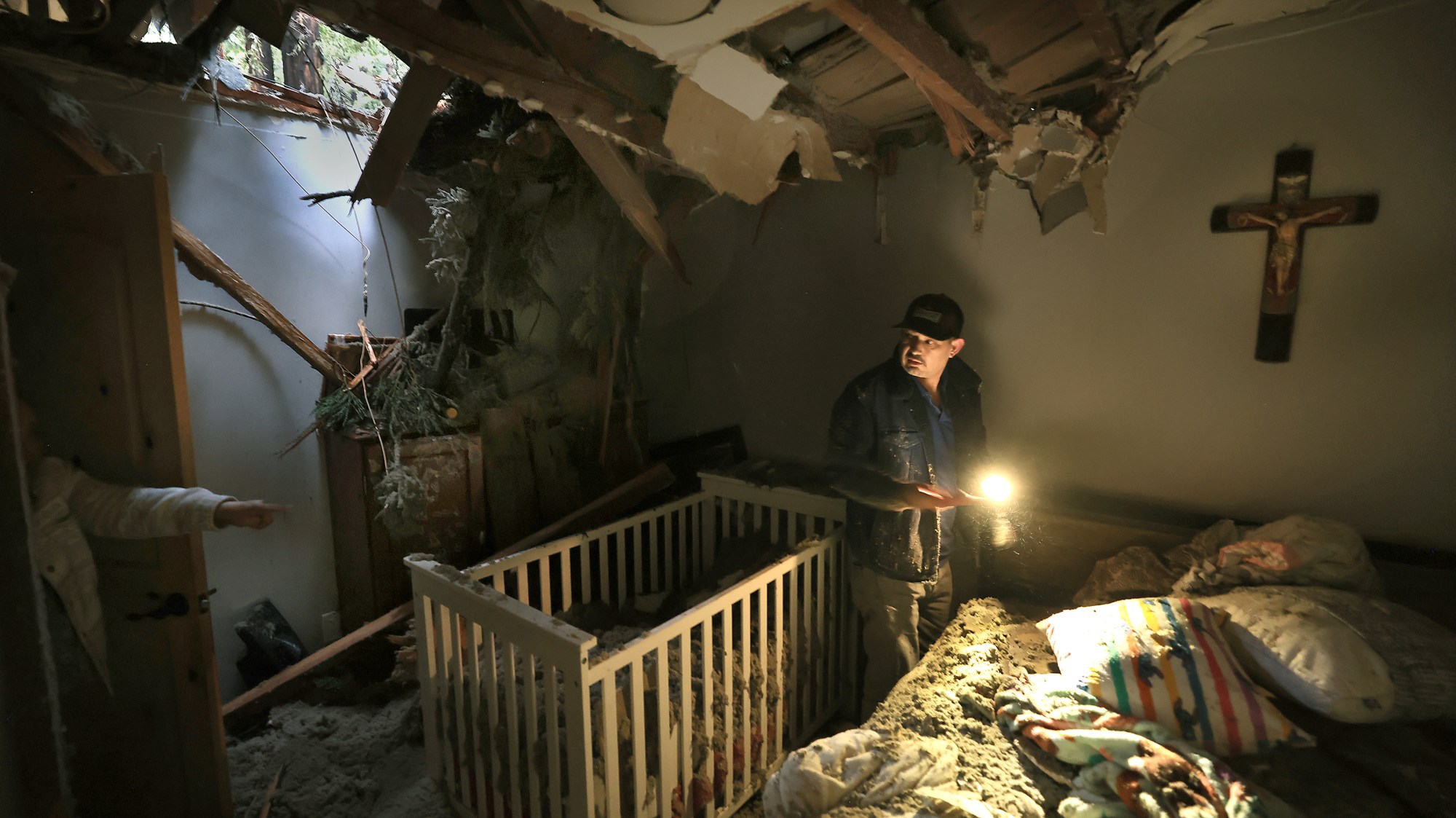 Chris MontaÃ±o looks for personal possessions in the room he...