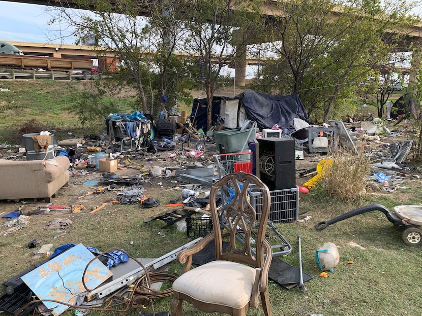 Behind the Shell station off Walnut Hill Lane, along North  Stemmons Freeway, a tent city...