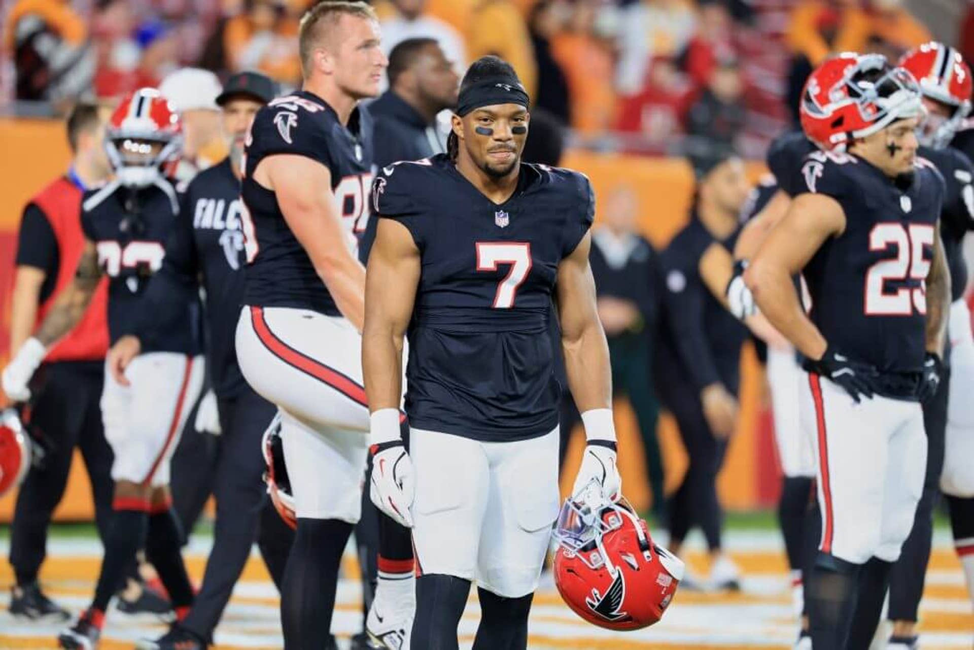 Bijan Robinson looks on during pregame warmups.