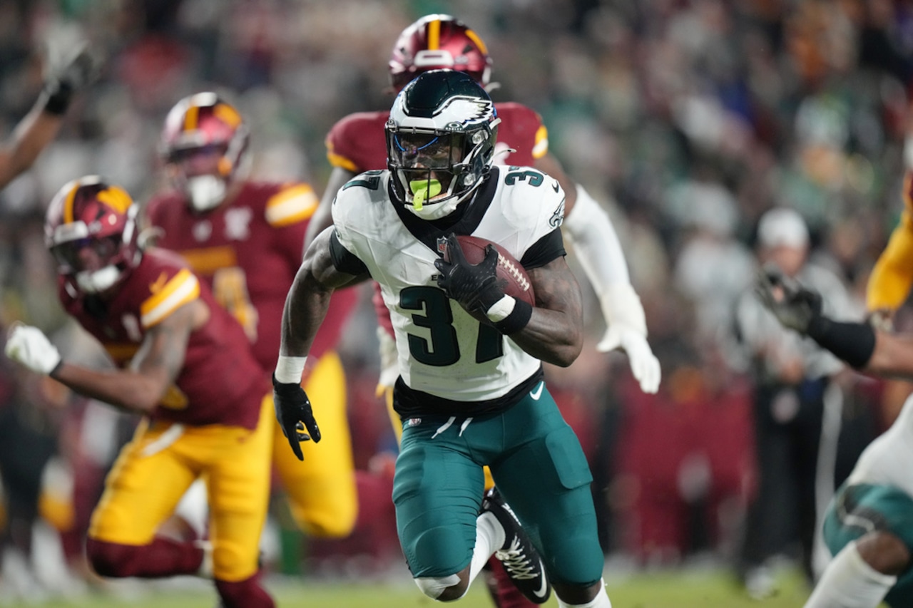 Philadelphia Eagles running back Tank Bigsby runs for a touchdown during an NFL game against the Washington Commanders on Saturday, Dec. 20, 2025, at Northwest Stadium in Landover, Maryland.