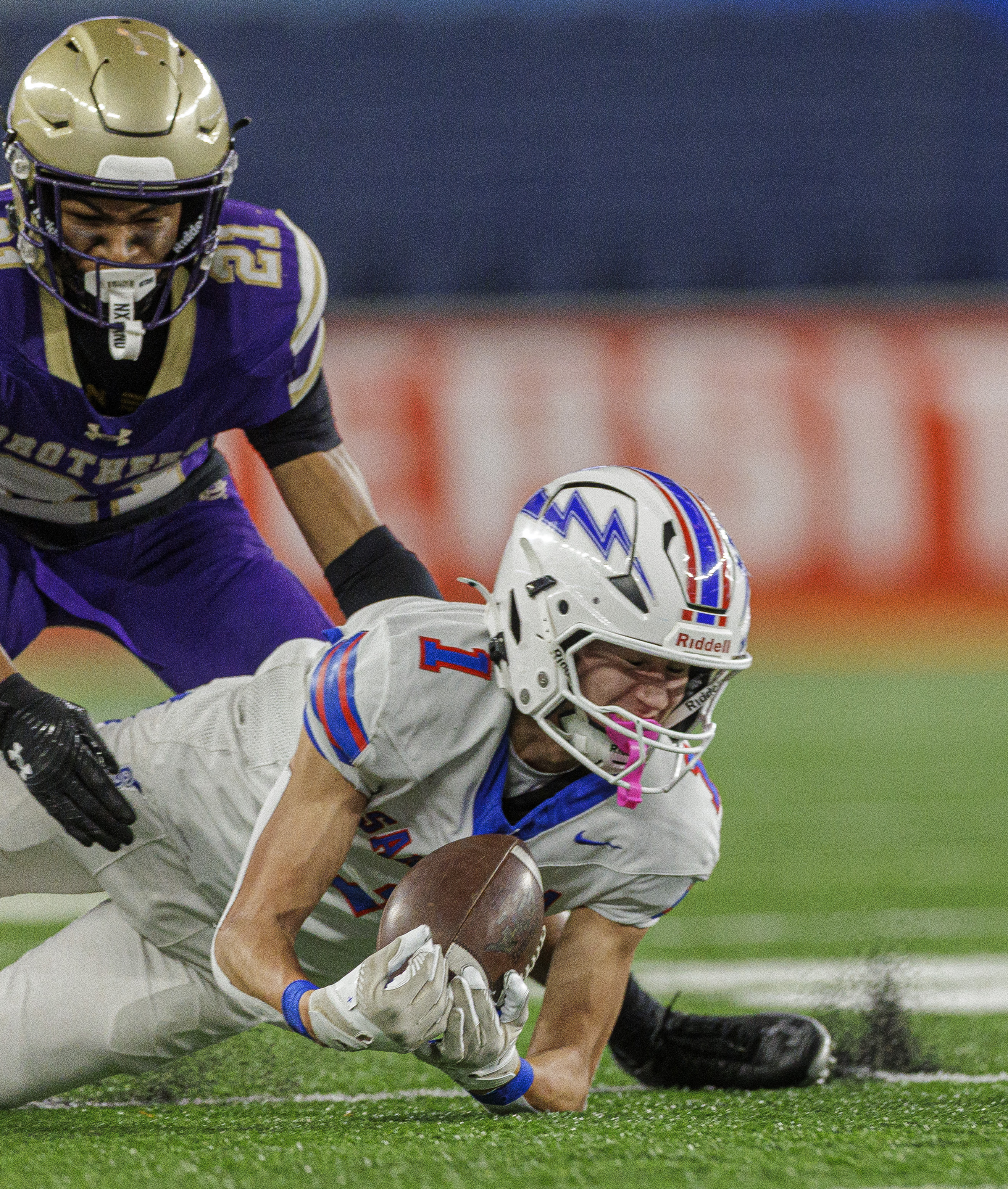 Saratoga Springs Blue Streaks Gavin Lafrance (1) makes a diving catch as the CBA Brothers and Saratoga Springs Blue Streaks fought for the New York State Class AA state title at JMA Wireless Dome Saturday, December 6, 2025. (N. Scott Trimble | strimble@syracuse.com)