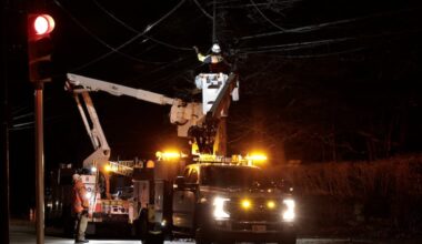PECO crews work to restore damaged power lines at Chestnut Hill Avenue near Germantown Avenue in Philadelphia on Sunday, Feb. 16, 2025. High winds felled a large tree and the adjacent power lines. High winds again caused outages on Friday into Saturday.