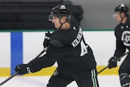 Dallas Stars defenseman Vladislav Kolyachonok takes a shot during a drill in a training...