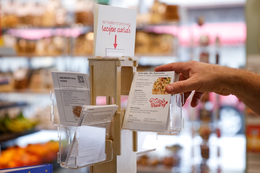 Owner Ari Lowenstein shares his recipe cards at Ari's Pantry in downtown Dallas. It's an...
