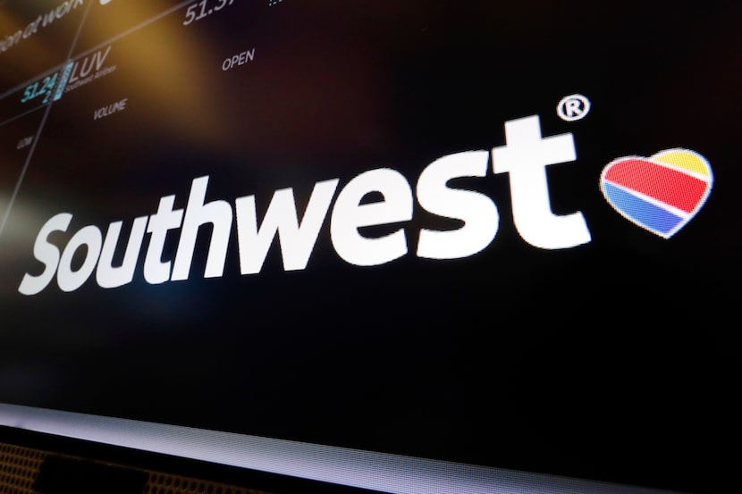 The logo for Southwest Airlines appears above a trading post on the floor of the New York...