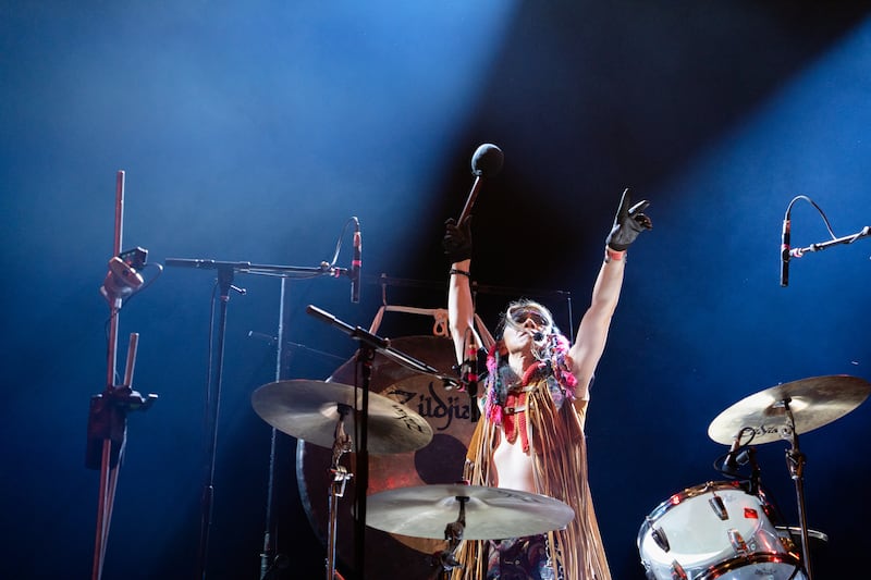 DESCRIBE THE IMAGE FOR ACCESSIBILITY, EXAMPLE: Photo of a chef putting red sauce onto an omelette.