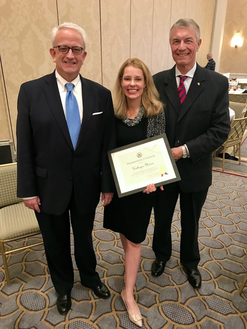 Charles Hosch (left) with his business partner Kate Morris (center) at an awards banquet.