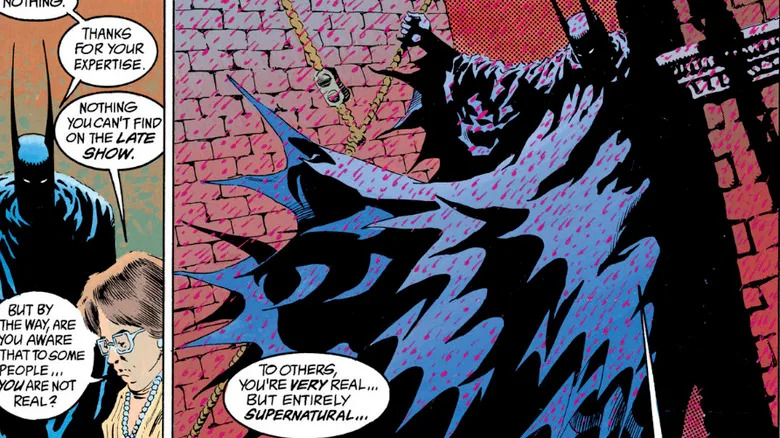 Batman perches on a building as drops of blood rain fall in a panel from Batman & Dracula Red Rain