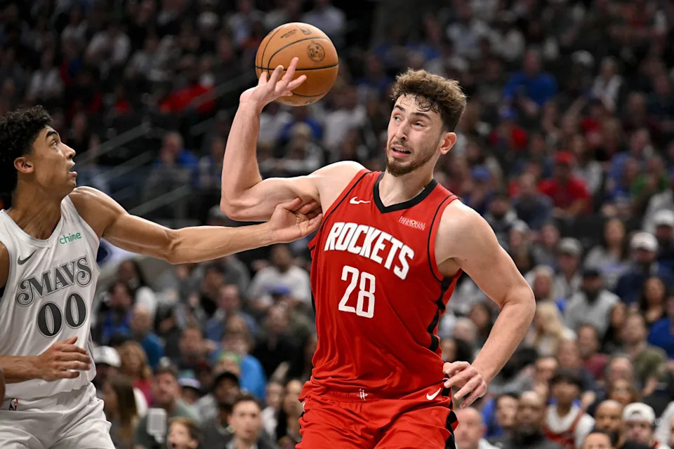 Feb 8, 2025; Dallas, Texas, USA; Dallas Mavericks guard Max Christie (00) and Houston Rockets center Alperen Sengun (28) in action during the game between the Dallas Mavericks and the Houston Rockets at the American Airlines Center. Mandatory Credit: Jerome Miron-Imagn Images