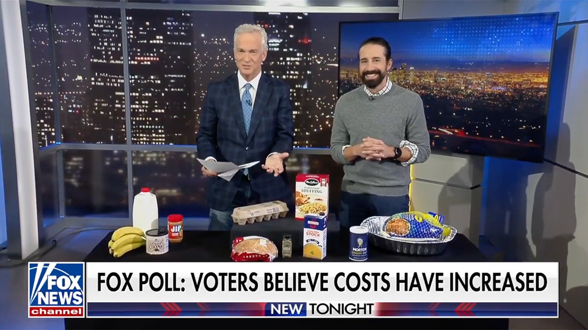 Fox News Channel's Trace Gallagher and Andrew Gruel stand in front of Thanksgiving food.