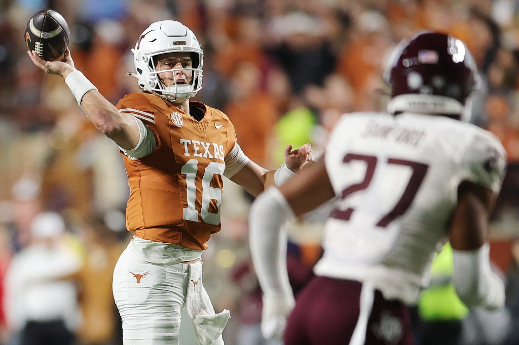 Texas Longhorns quarterback Arch Manning #16 throws a pass during a game against the Texas A&M Aggies.Arch Manning #16 of the Texas Longhorns throws a pass against the Texas A&M Aggies
