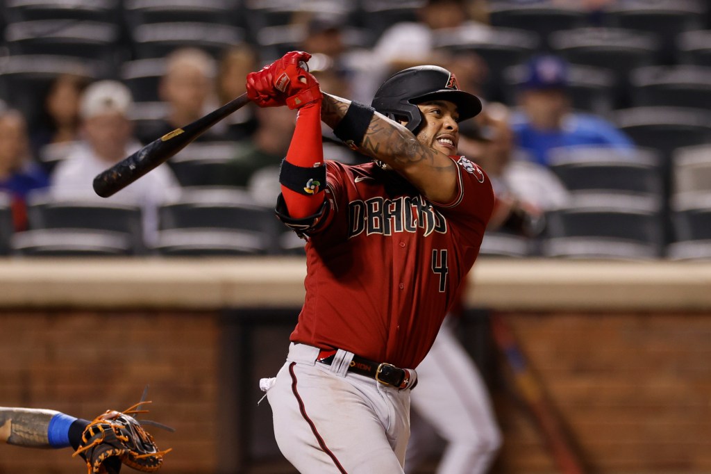 Ketel Marte of the Arizona Diamondbacks hits an RBI double.