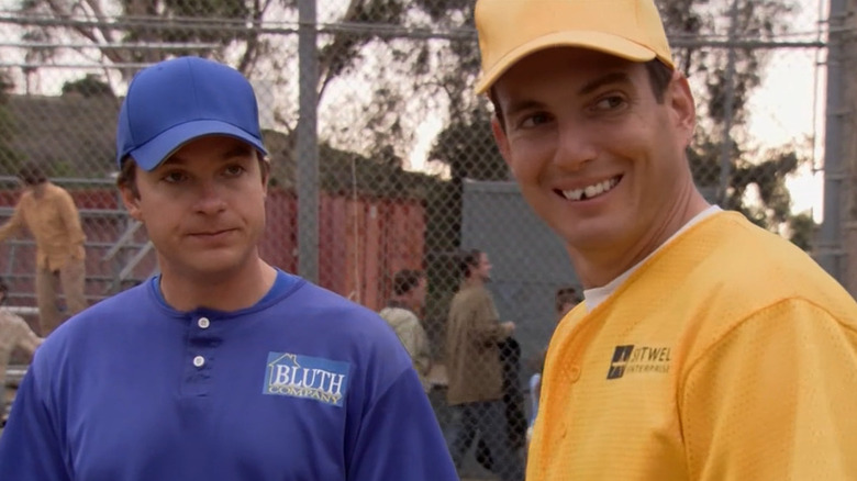 Michael (Jason Bateman) and Gob Bluth (Will Arnett) play baseball in Arrested Development