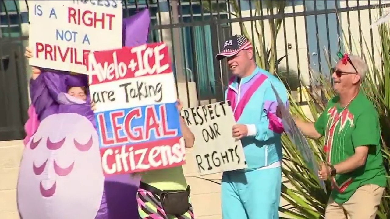 Demonstrators protest outside Mesa Gateway Airport