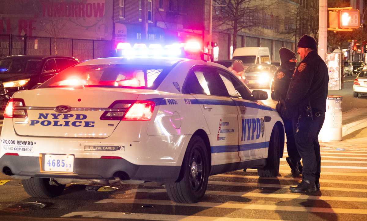 police car at scene where men were shot in brooklyn