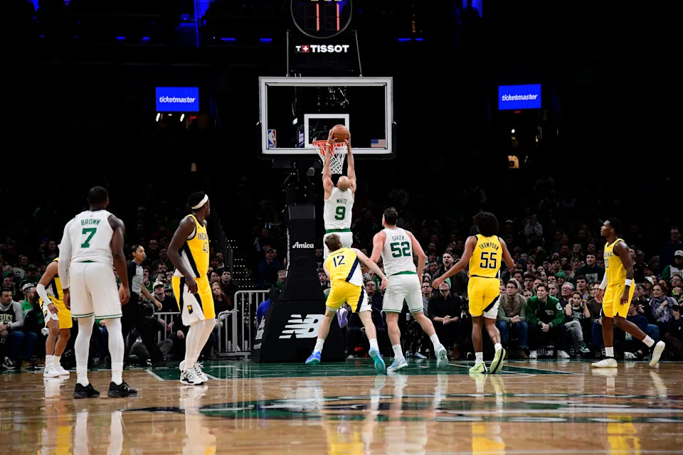 Dec 22, 2025; Boston, Massachusetts, USA; Boston Celtics guard Derrick White (9) dunks the ball during the second half against the Indiana Pacers at TD Garden. Mandatory Credit: Bob DeChiara-Imagn Images