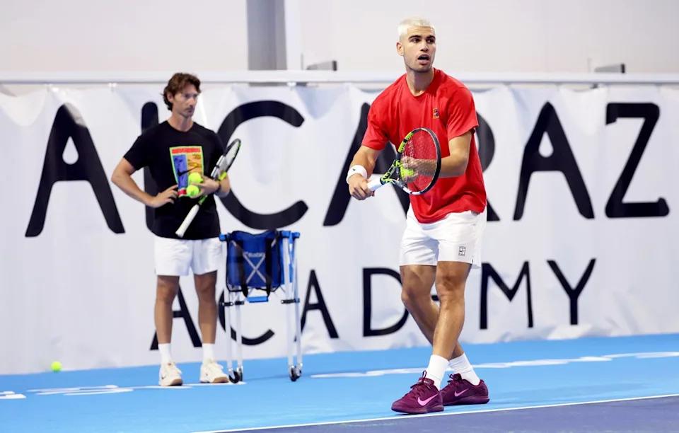 Carlos Alcaraz of Spain serves while being watched by his coach at the time Juan Carlos Ferrero (Getty)