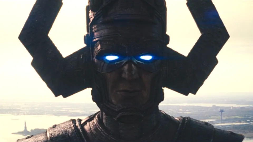 Galactus with eyes glowing blue standing in New York City in The Fantastic Four: First Steps.