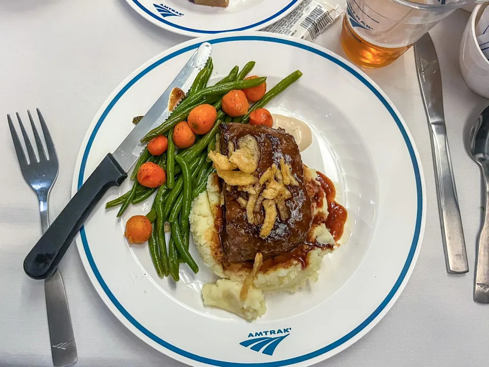 A meal is served in the dining car.