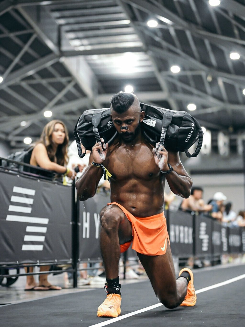 Fitness coach Vijay Andrews at the sandbag lunges station during his debut Hyrox race in Singapore on November 30. Photo: Vijay Andrews