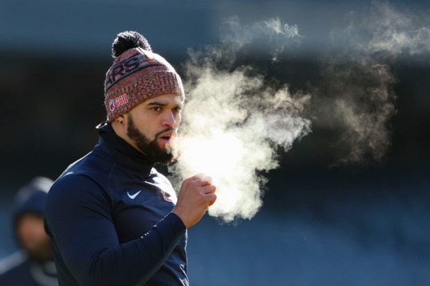 Bears quarterback Caleb Williams warms up in the cold to face the Browns on Sunday, Dec. 14, 2025, at Soldier Field. (Brian Cassella/Chicago Tribune)