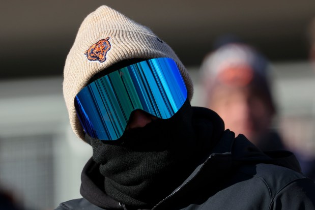 A Bears fan wears a ski mask to stay warm before a game against the Browns on Sunday, Dec. 14, 2025, at Soldier Field. (Brian Cassella/Chicago Tribune)