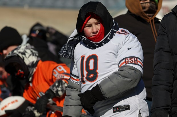 Bears fans watch their team warm up to face the Browns on Sunday, Dec. 14, 2025, at Soldier Field. (Brian Cassella/Chicago Tribune)