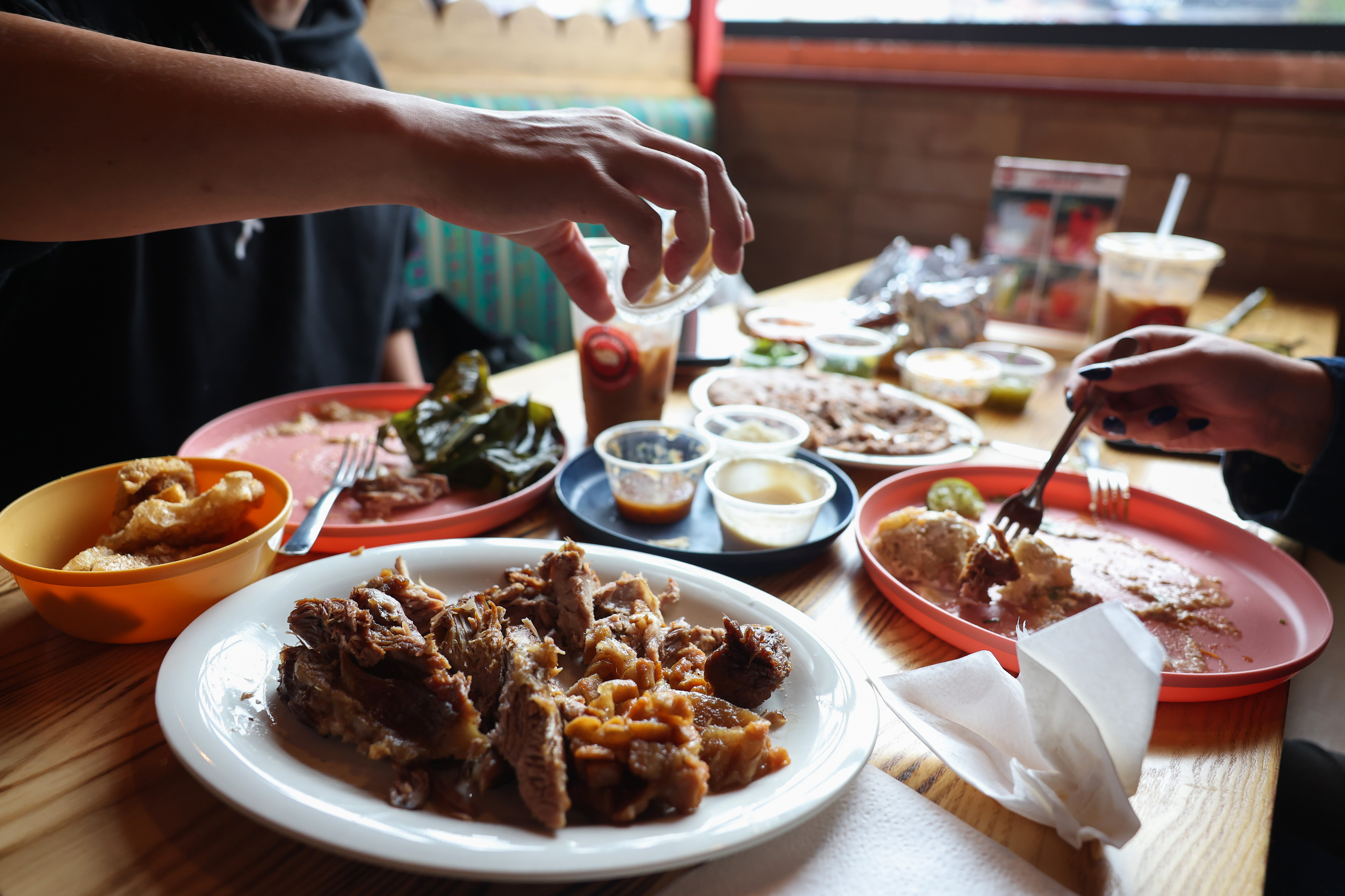 Diners have a late lunch at Carnitas Uruapan, 3801 W....