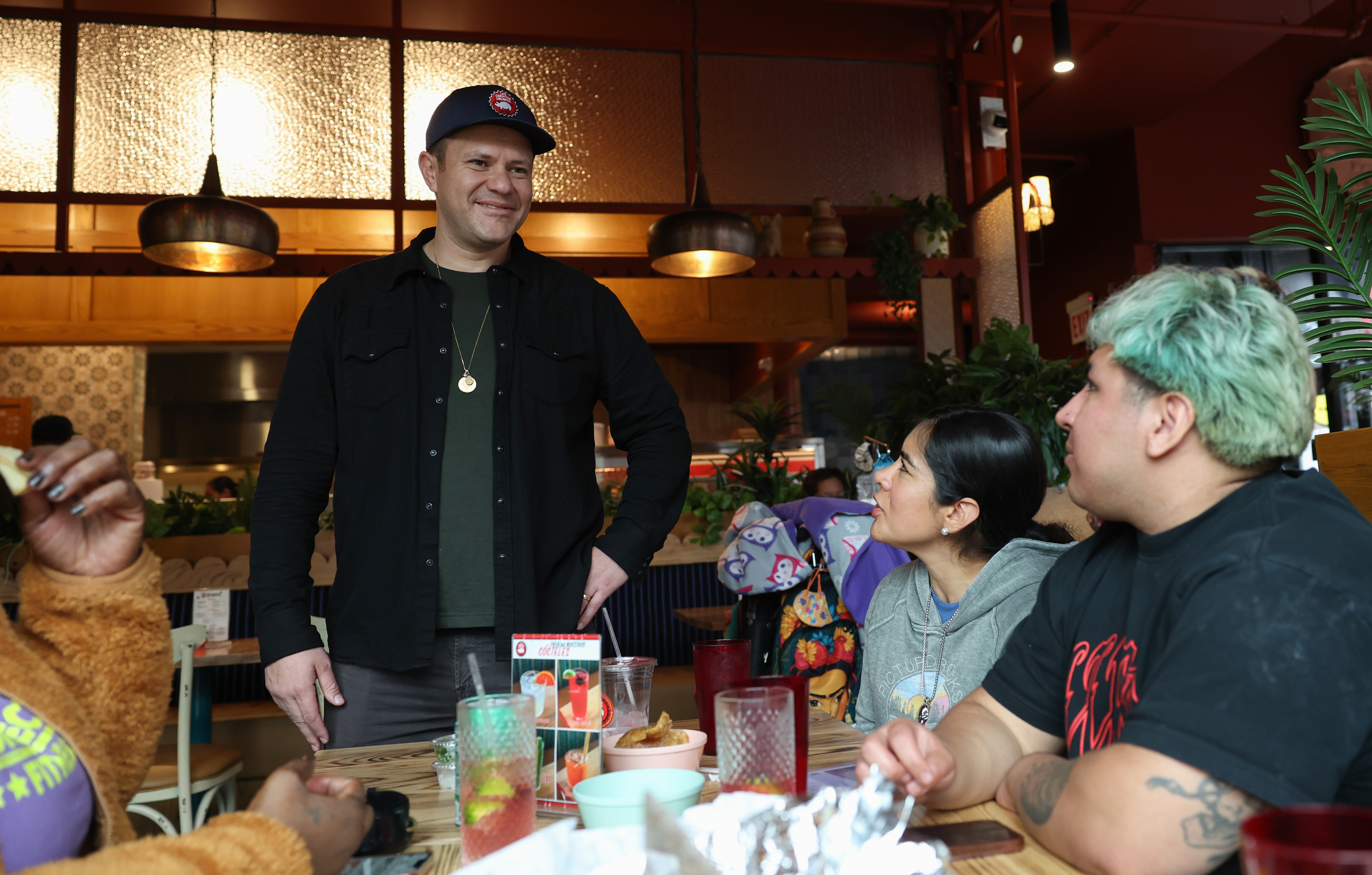 Marcos Carbajal talks with diners at Carnitas Uruapan in the...