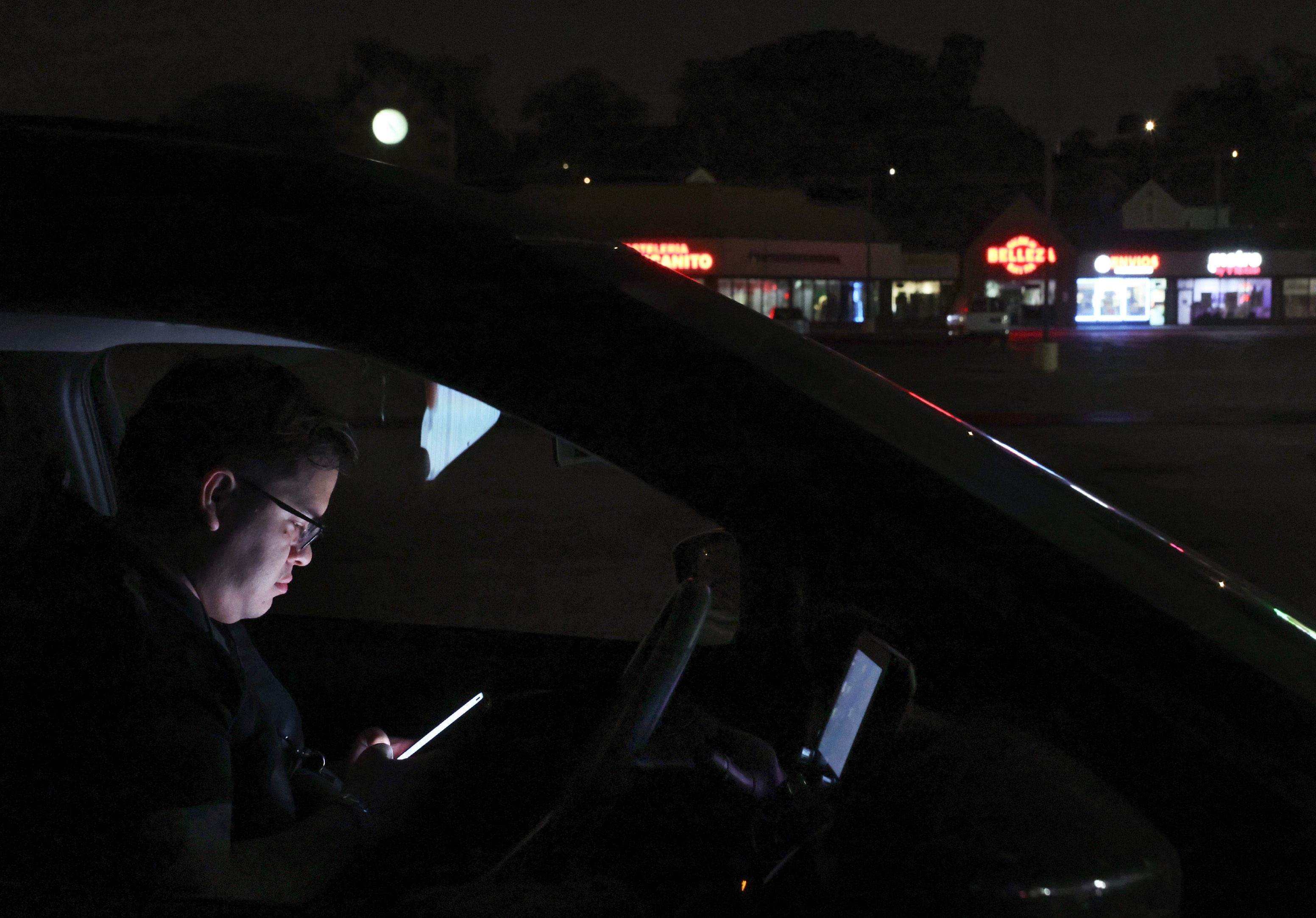 Ismael CordovÃ¡-Clough sits in his car at Clock Tower Plaza...