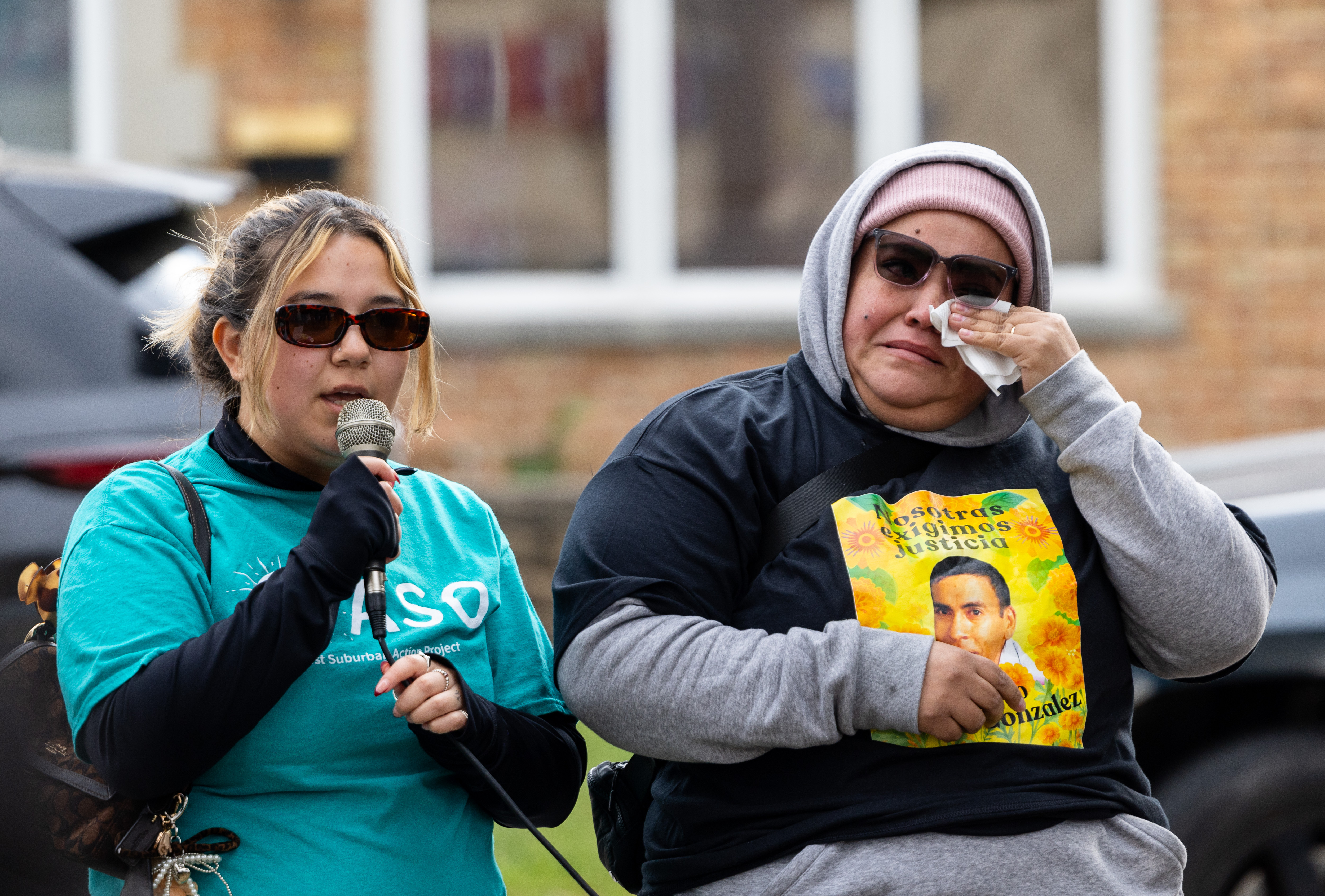 Ana Torres, left, an organizer with the P.A.S.O. West Suburban...