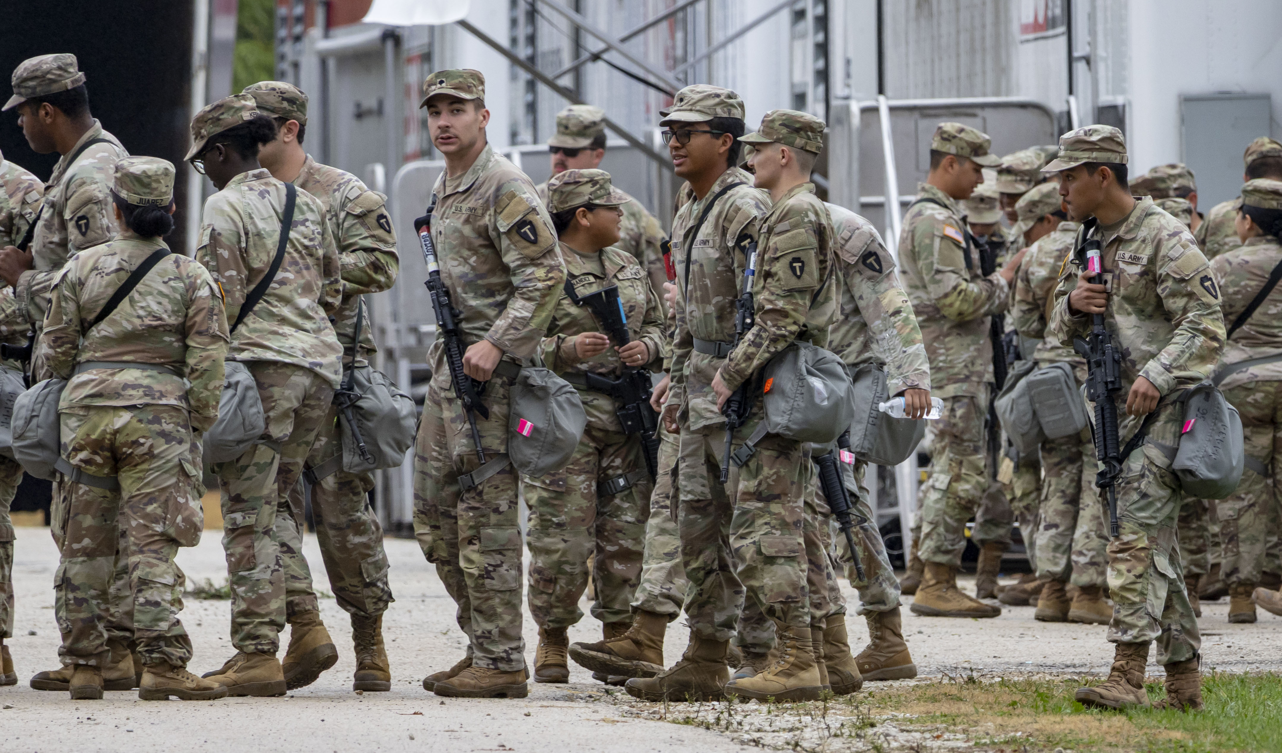 Members of the Texas National Guard arrive Oct. 7, 2025,...